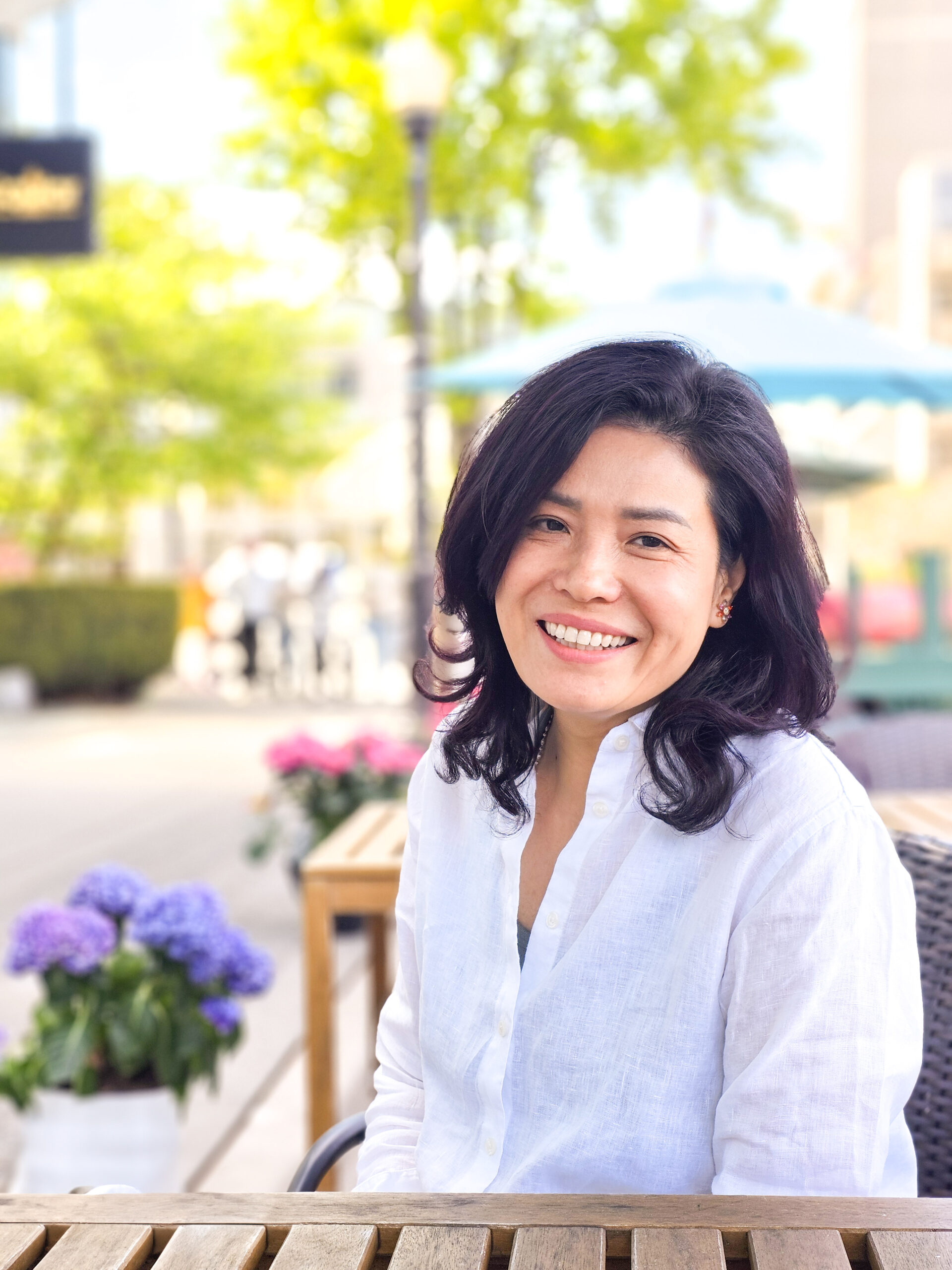 pretty Vietnamese woman on cafe patio